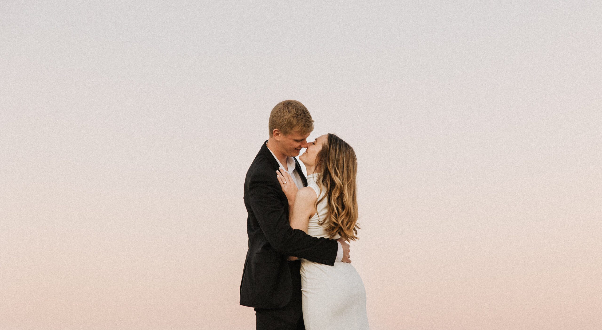 couple embracing at sunset in des moines iowa